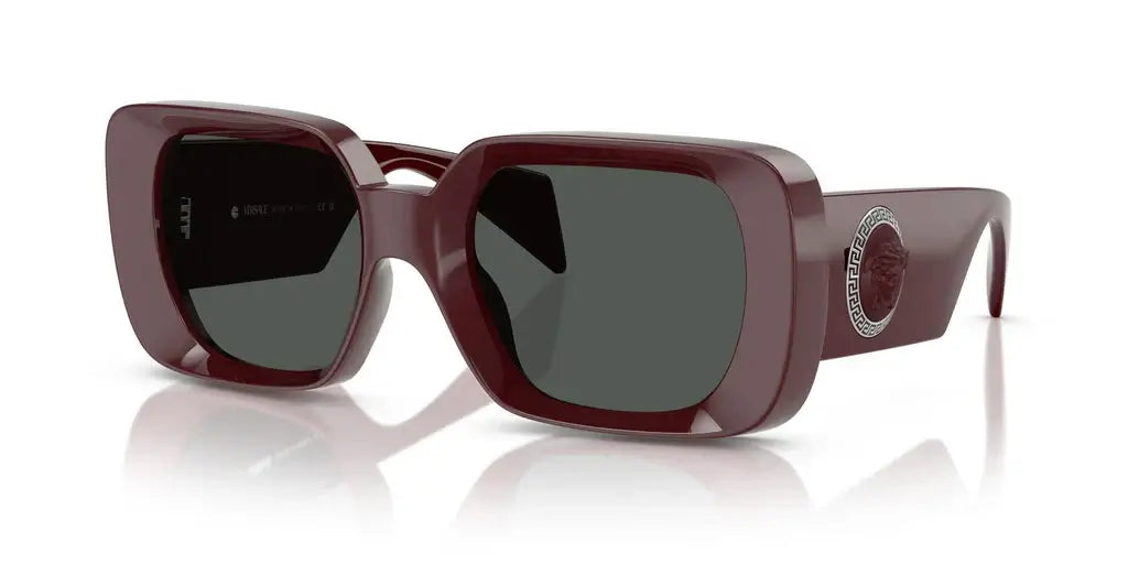 Versace 0VE4473U sunglasses in burgundy with oversized frames and logo detail, perfect for stylish summer looks.