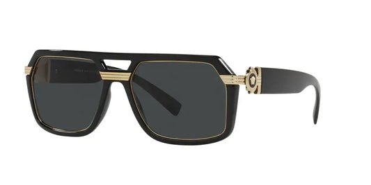 Versace 0VE4399 sunglasses featuring a bold black and gold design with dark lenses, showcasing luxury and style.