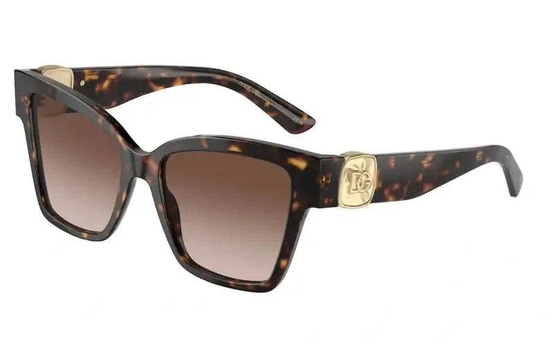 Dolce & Gabbana 0DG4470 sunglasses in tortoise shell with gradient lenses and logo detail. Stylish eyewear for fashion enthusiasts.