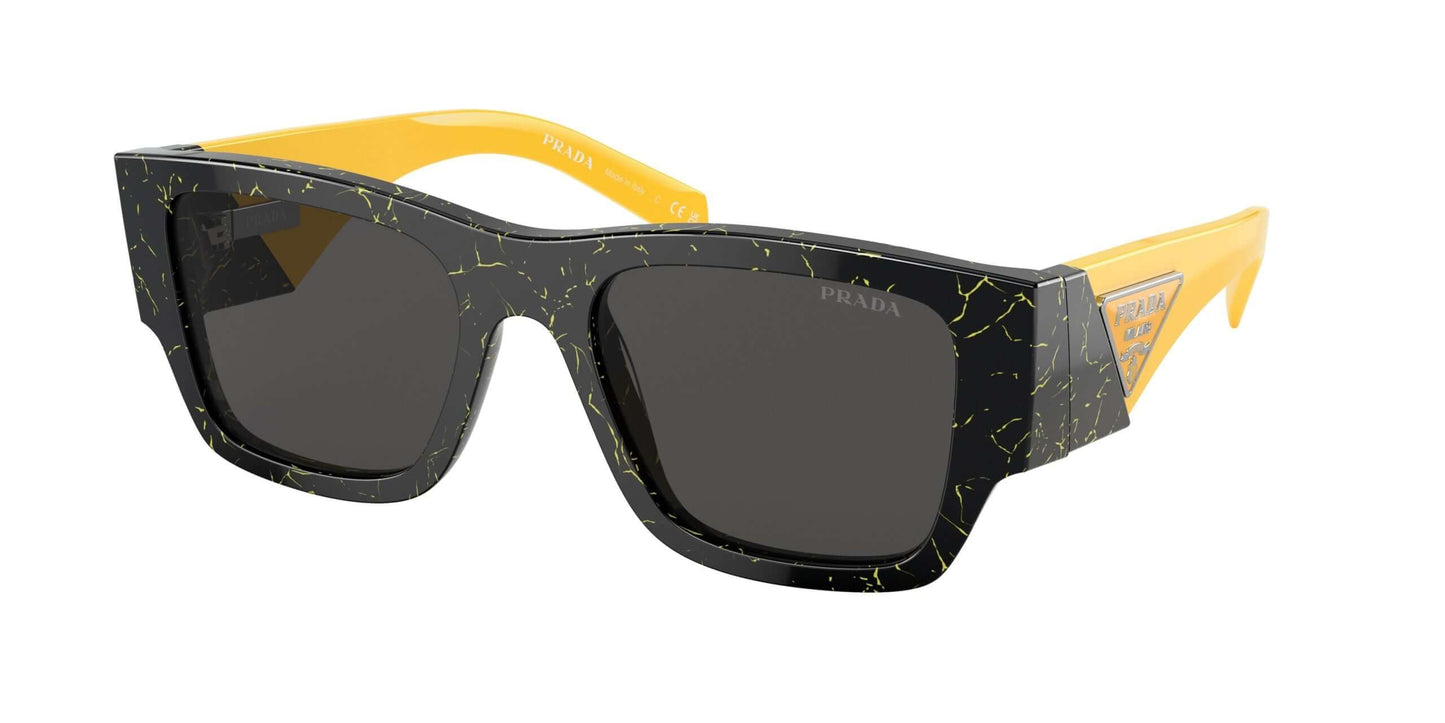 PRADA 0PR 10ZS oversized sunglasses with black and yellow cracked design and dark lenses.