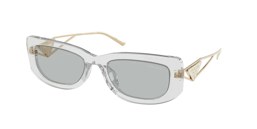 PRADA 0PR 14YS oversized clear sunglasses with gray lenses and golden accents, stylish eyewear for fashion-forward looks.